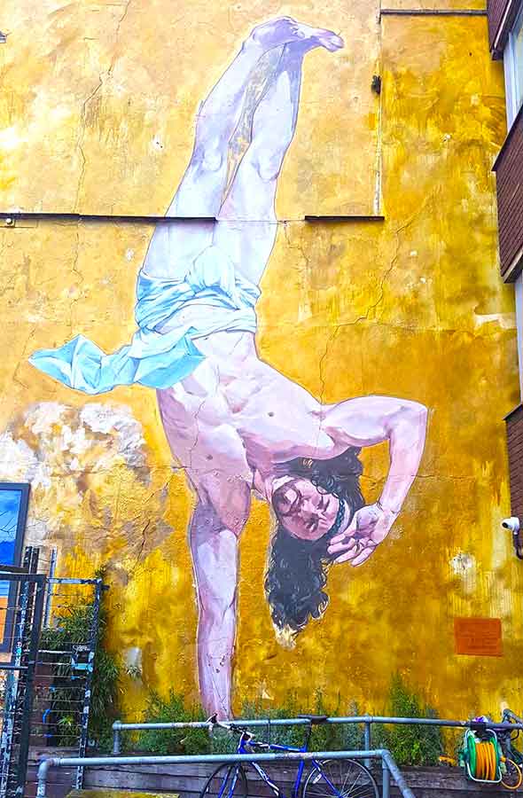 Giant Jesus mural painted on upside down outside of Hamilton House
