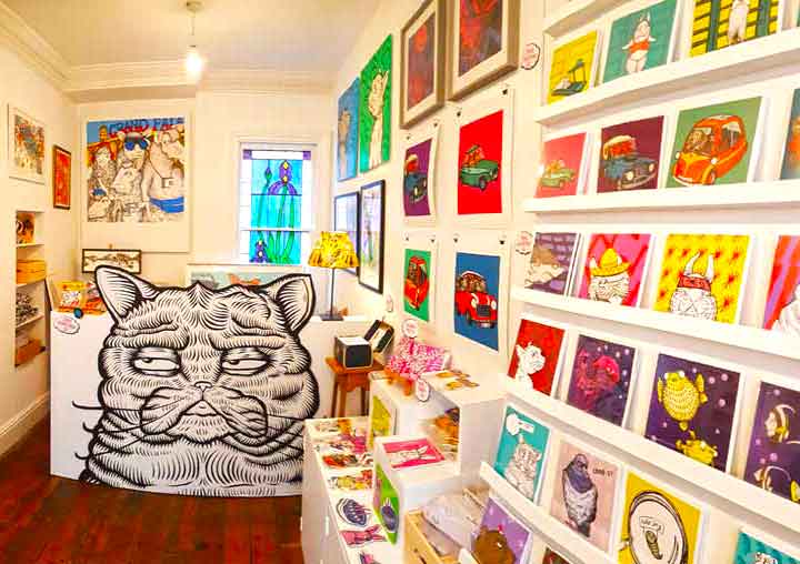 The studio, gallery, and shop of Lucas Antix is at the end of Picton Street with a large black cat the counter