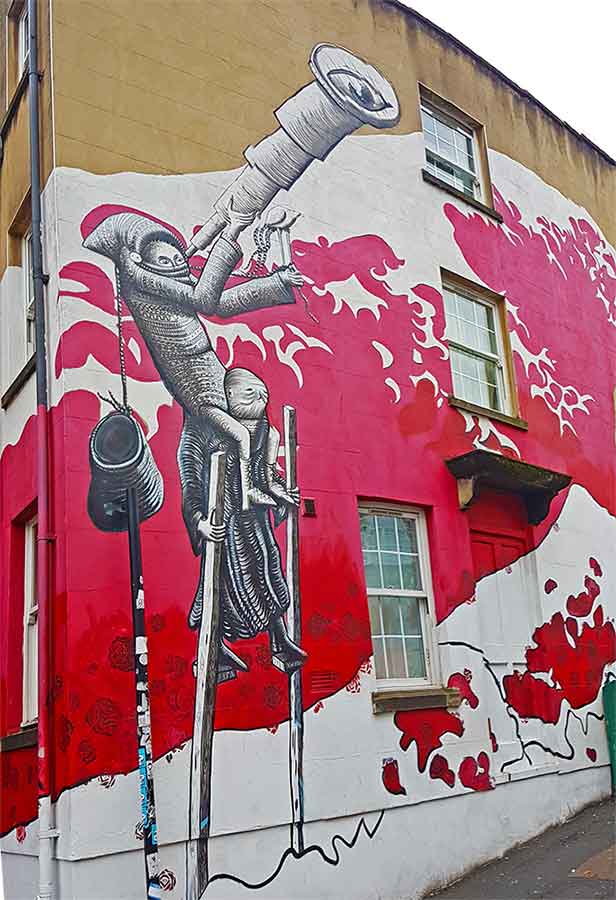 A large street art in Stokes Croft painted in a spacious walls