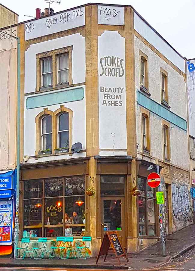 "Beauty from Ashes" store with a "Stokes Crofts" painted Infront of the building