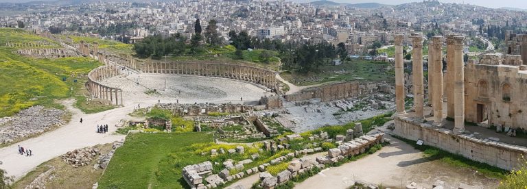 Aerial view of the ruins in Jerash - Temple of Zeus (right), the Forum (middle) and Cardo Maximus (left) with a stunning view of the city