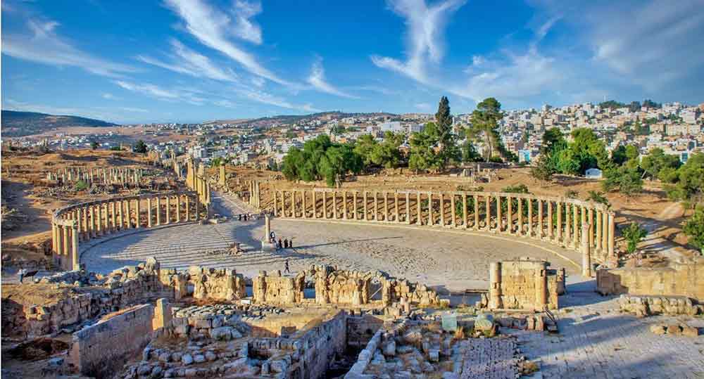 Oval columns at Jerash Ruins, Jordan with hills in thebackground