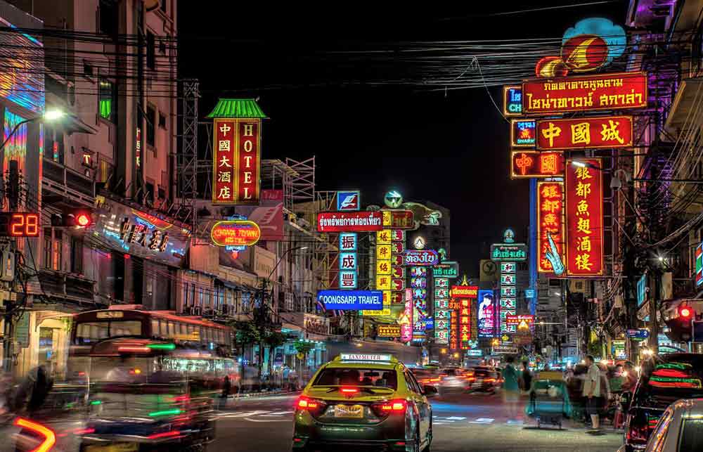 Neon lights and busy road in China Town bangkok. 