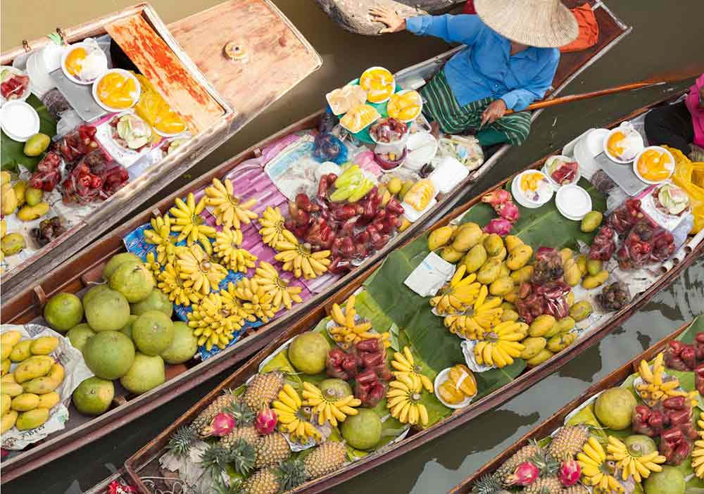 fruit sellers on boats in Bangkok. 