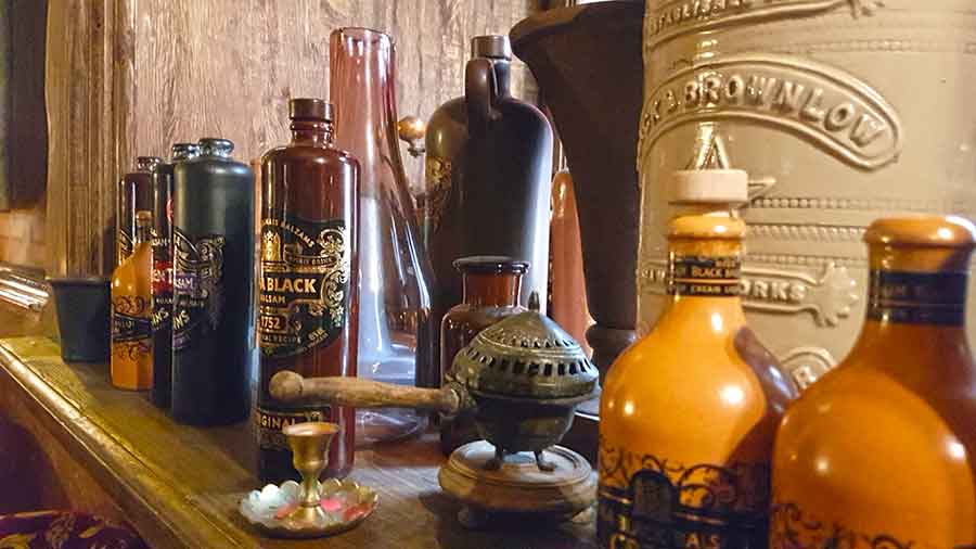 Best Riga 3 Days Itinerary: Exploring ‘Paris of the North’ 10 Different items in the Riga Black Magic cafe with ceramic brown bottles of Riga Black Balsam