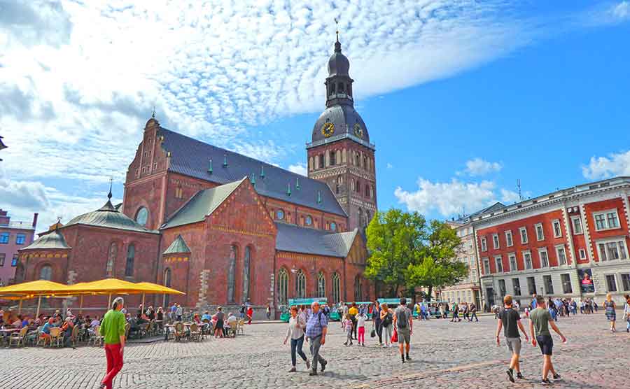 Best Riga 3 Days Itinerary: Exploring ‘Paris of the North’ 13 The Riga Dom with people walking on the courtyard outide.