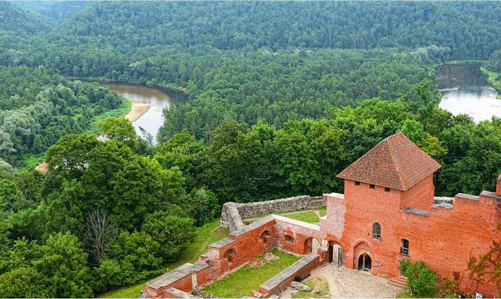 Best Riga 3 Days Itinerary: Exploring ‘Paris of the North’ 29 View of a Turaida Castle in Guja National Park in Riga looking down on a valley.