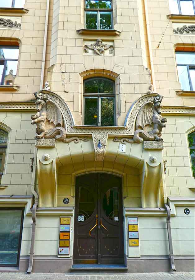 Where to See Art Nouveau in Riga, Latvia: Exploring The Art Nouveau District, Riga 14 Beautiful entrance with two dragons carved at the top of the doorway in apartment building, Antonijas Street 8