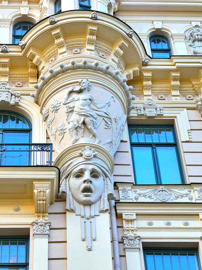 Where to See Art Nouveau in Riga, Latvia: Exploring The Art Nouveau District, Riga 11 Close up look of the carved face and statue in Alberta Street of Latvia