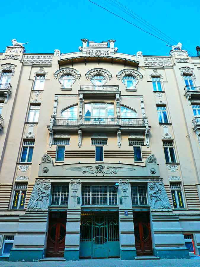 Where to See Art Nouveau in Riga, Latvia: Exploring The Art Nouveau District, Riga 10 The Lyebedinskiy apartment building, Alberta Street 4 in Latvia with carved art at the top of the entrance