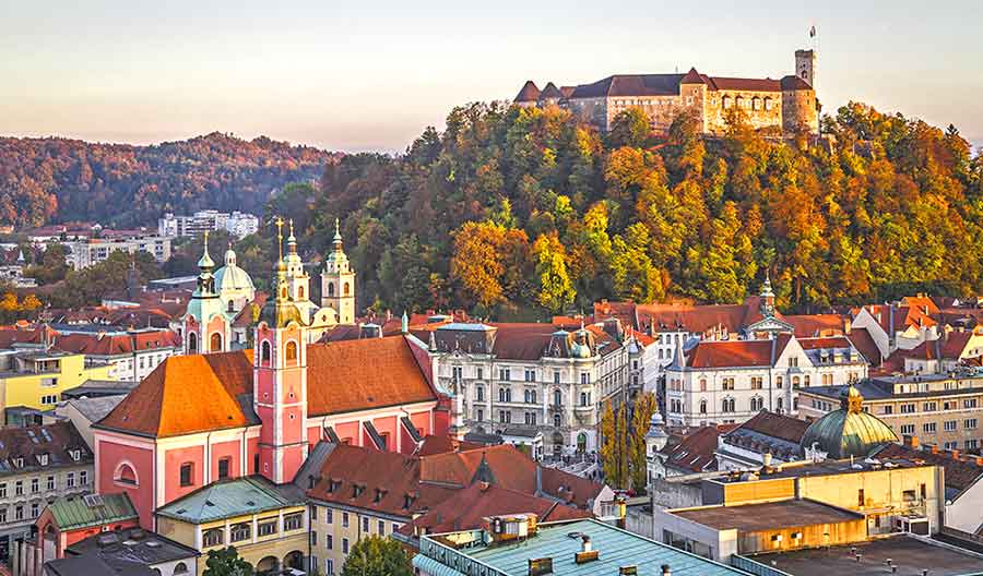 Ljubljana Castle perched atop a hill overlooking the charming city of Ljubljana and the surrounding landscapes