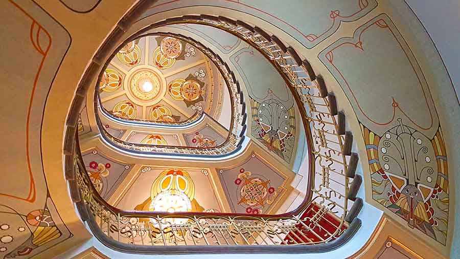 Where to See Art Nouveau in Riga, Latvia: Exploring The Art Nouveau District, Riga 8 The Spiral Staircase at the Riga Art Nouveau Museum with beautiful art ceilings
