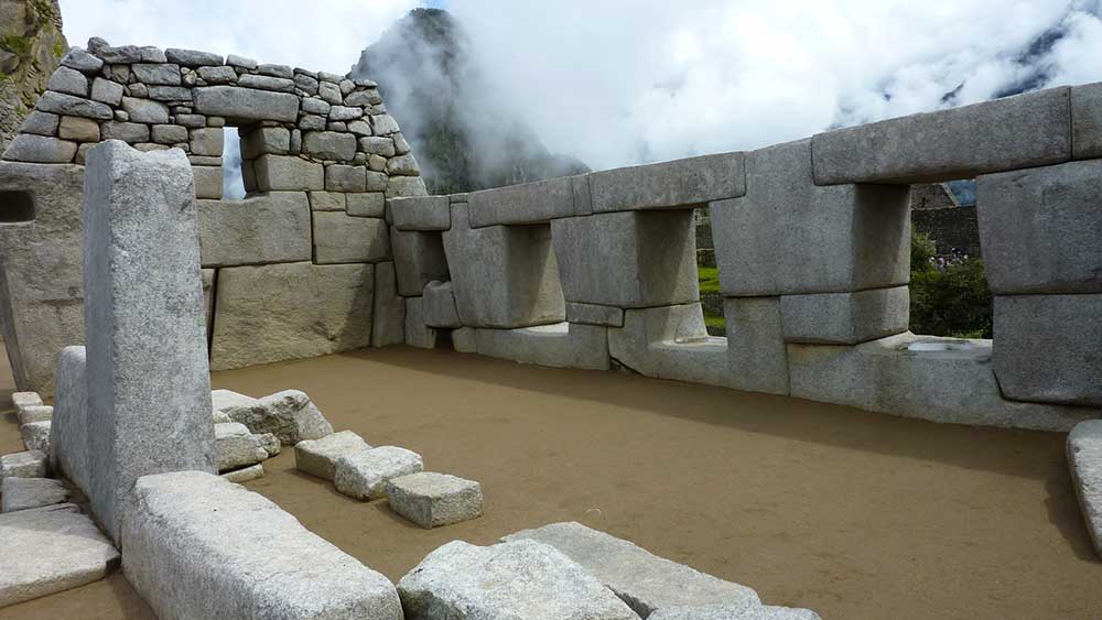 G Adventures Inca Trail Review: What to Expect on The Inca Trail Trek to Machu Picchu 23 One of the buildings at the ruins of Machu Pichhu showing blocks which tessalte together.
