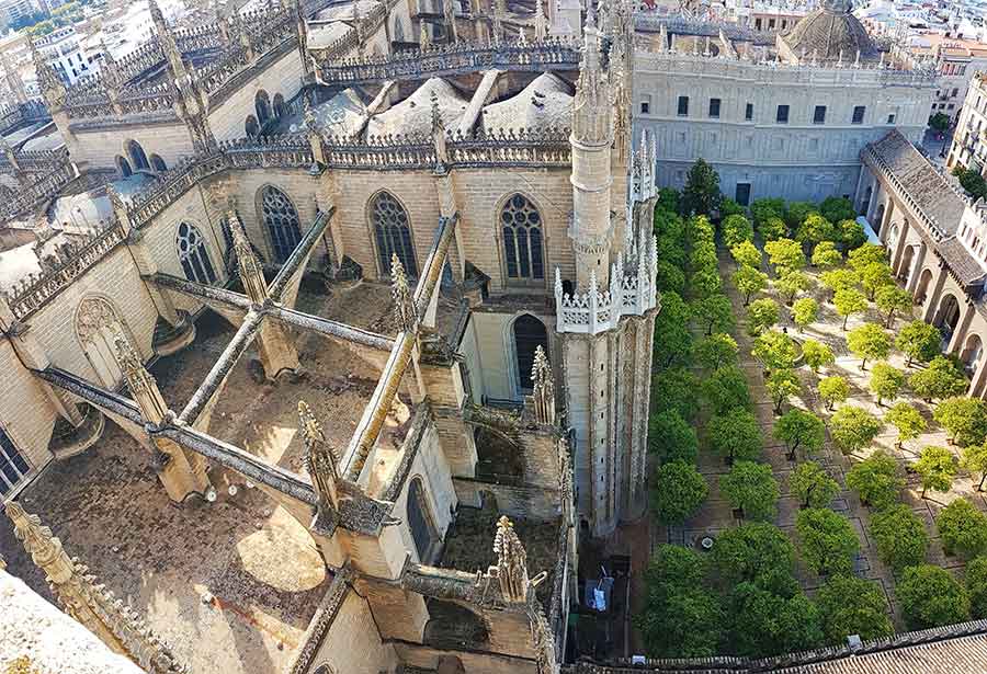 Looking down over Seville Cathedral roftop onto the roof and orangery from the Giralda. The Giralda is one of the top things to see in Seville.