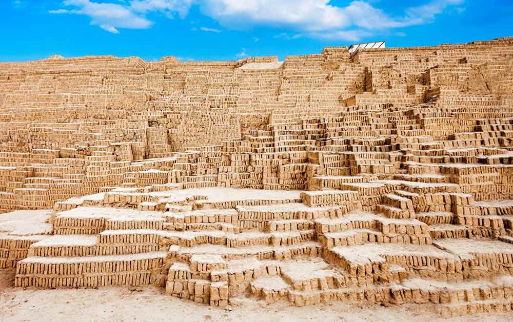 Stacked up light coloured adobe blocks at Huaca Pucllana