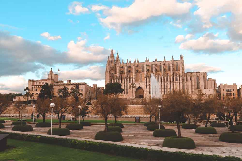 La Seu Cathedral in Palma de Mallorca viewed from the park below, a Gothic masterpiece and key point of interest in the Balearic Islands.