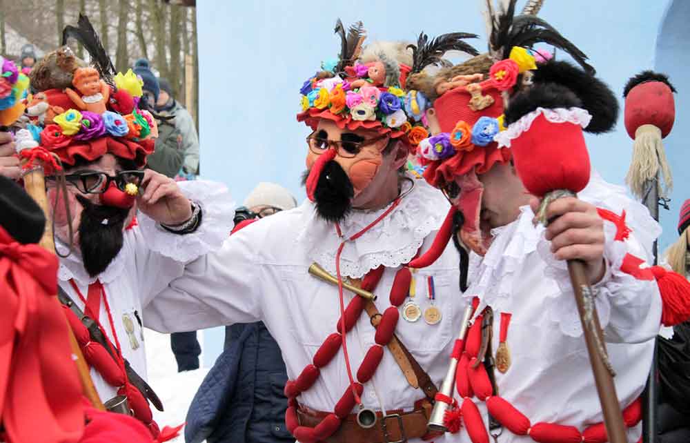 People wearing comical masks at Massopust Parade