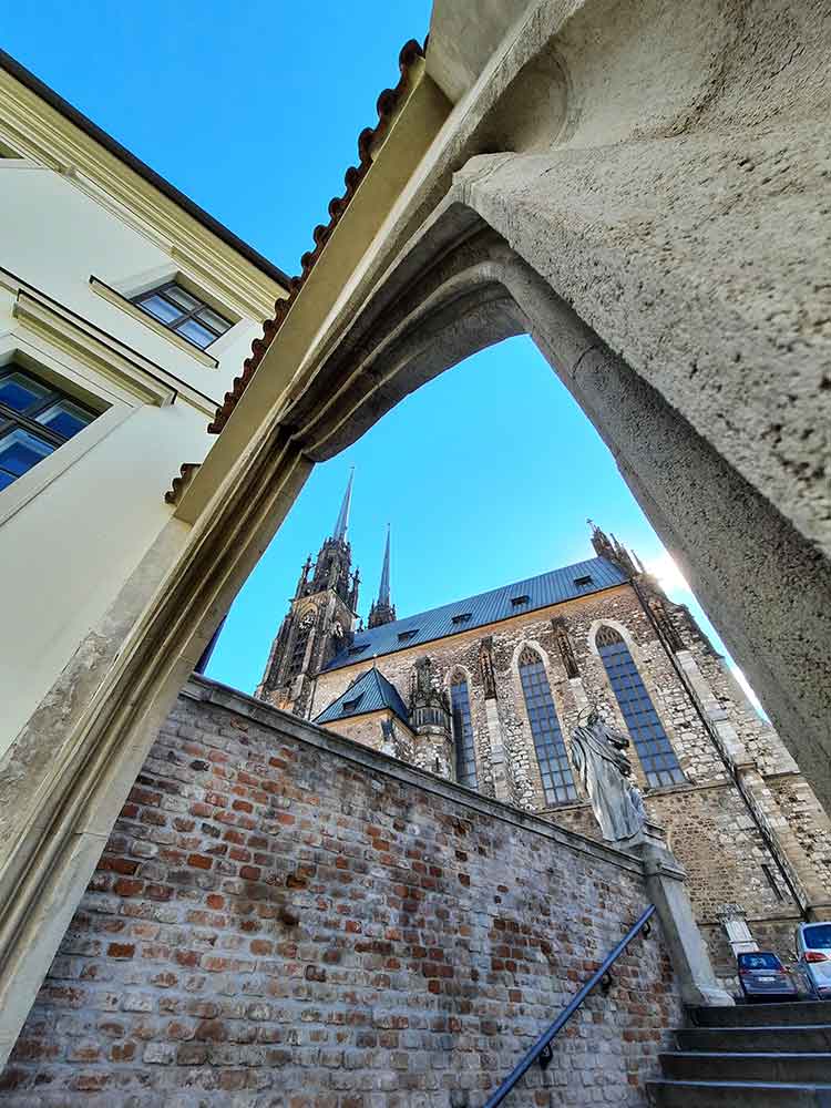 Street view looking up at the spires of St Peter & St Paul Cathedral.