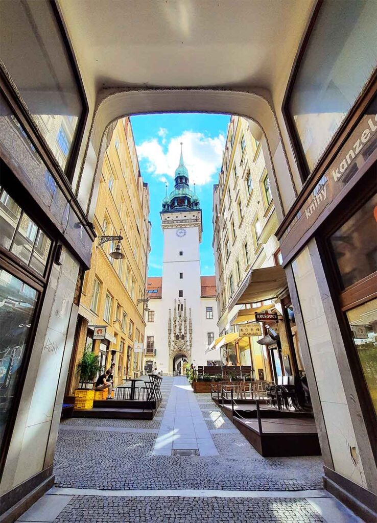 A view of Old Town Tower through an arcade.