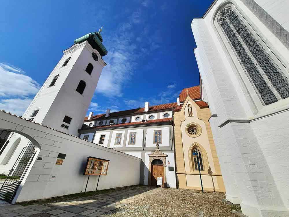 the white Tower of the Dominican Monastery on Piarist Square