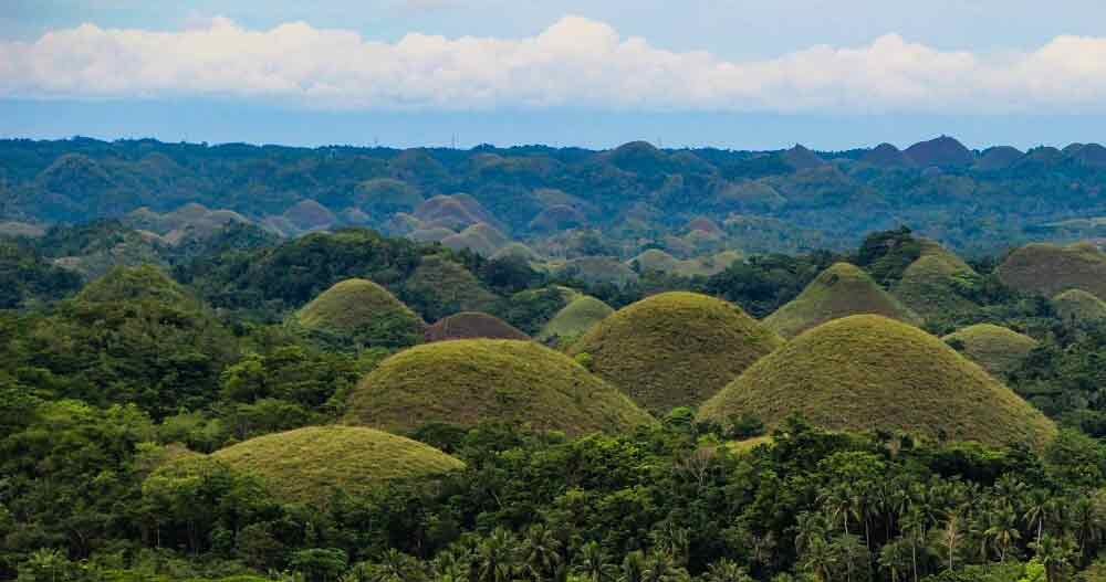 Chocolate Hills in Philippines featuring numerous giant hills like a chocolate balls popping up from green vegetation