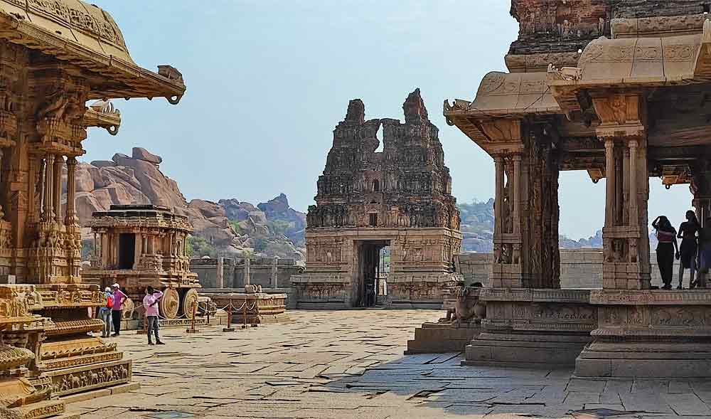 Hampi Monuments in India featuring ruins structures, temples, and arch entrance