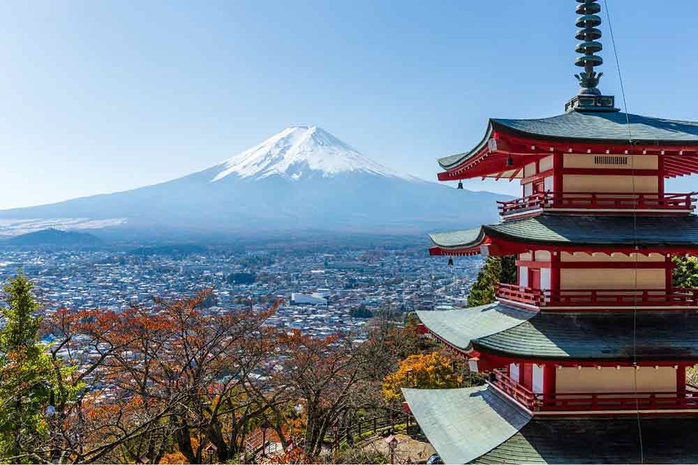 Mount Fuji in Japan with its perfect cone-shaped covered with snow at the top with panoramic views of the city