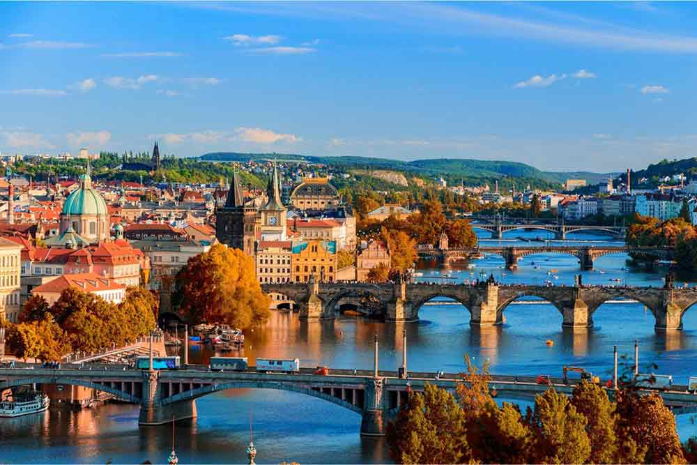 The Vlatava River in Prague with four bridges crossing the river. 