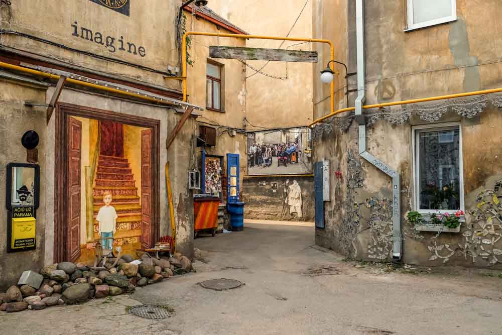 Best Of The Baltics: 23 Unmissable Things To Do In The Baltics 23 Kaunas features a diverse street art scene with paintings on walls, art hanging on walls, and carvings on walls.