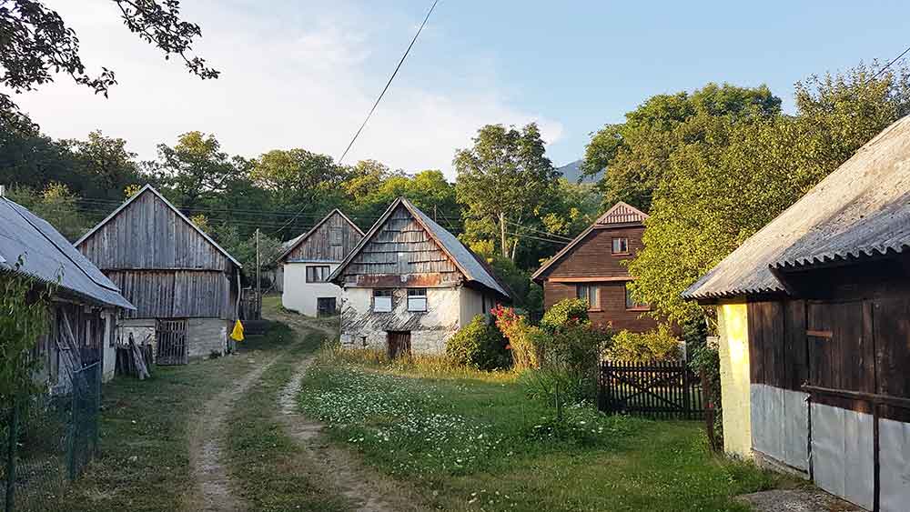 The Farm Houses near Pljesevica Hike features a triangular shaped-roof and wooden walls