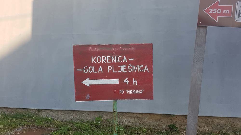 A red sign with notes at the start of the Pljesevica Mountain Trail