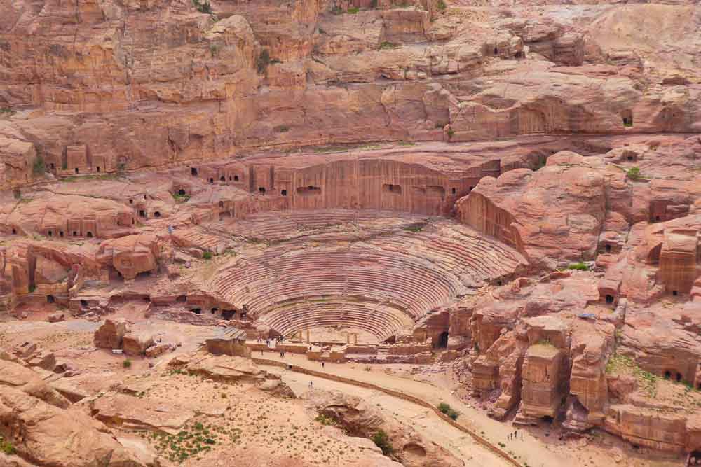 Best 2 Days in Petra Itinerary: Self-Guided Two Days in Petra, Jordan 9 Aerial view of The Theatre in Petra, Jordan - an open air theatre with a sandstone staircase or seating's surrounded by a large rock formations