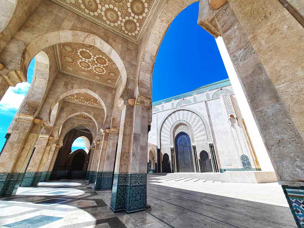 Hallway in Hassan II Mosque, Casablanca features the intricate geometric patterns of ceiling and stunning marble works 