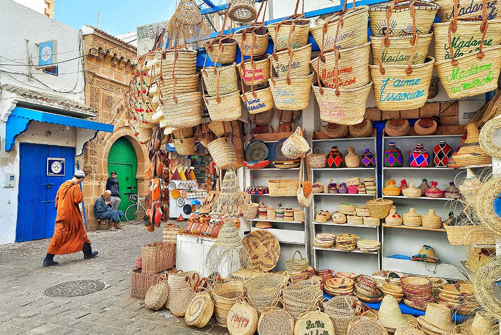 Market stalls in Essouaira selling woven products.