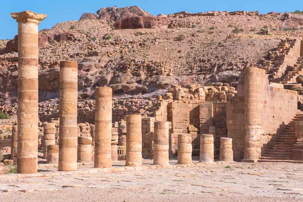 Best 2 Days in Petra Itinerary: Self-Guided Two Days in Petra, Jordan 20 The Colonnaded Street with ascending pillars made of sand stone on a sunny day at Petra, Jordan
