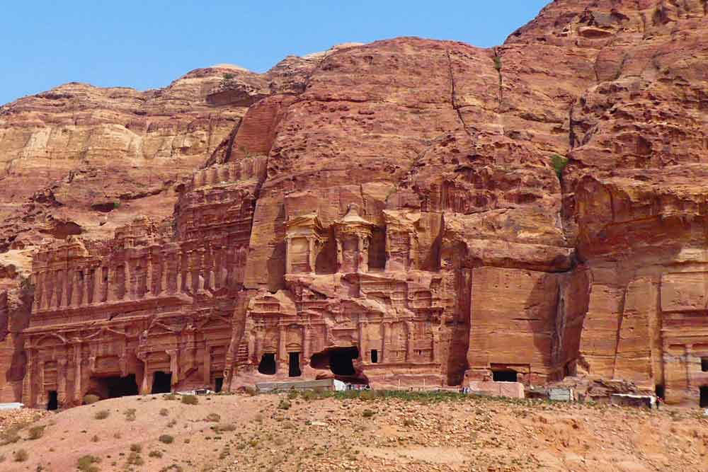 Corinthian Tomb in Petra features a rock-cut architecture in a sand stone color hue