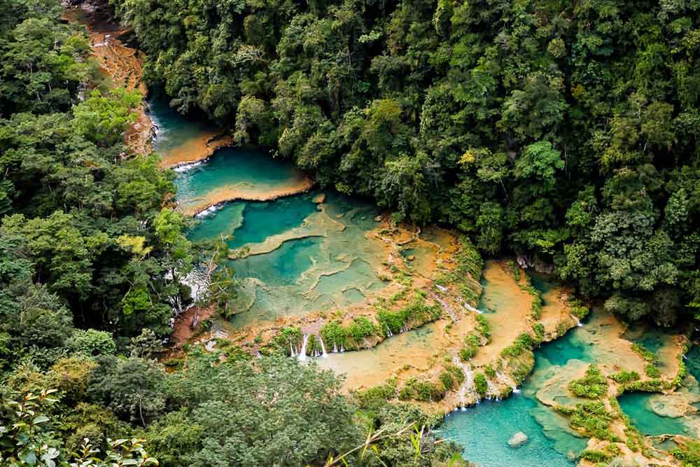 The perfect Guatemala 2 week itinerary for the ultimate backpacking Guatemala trip. See ALL of the main highlights of Guatemala including Tikal, Antigua, Lake Atitlan & Semuc Champey.