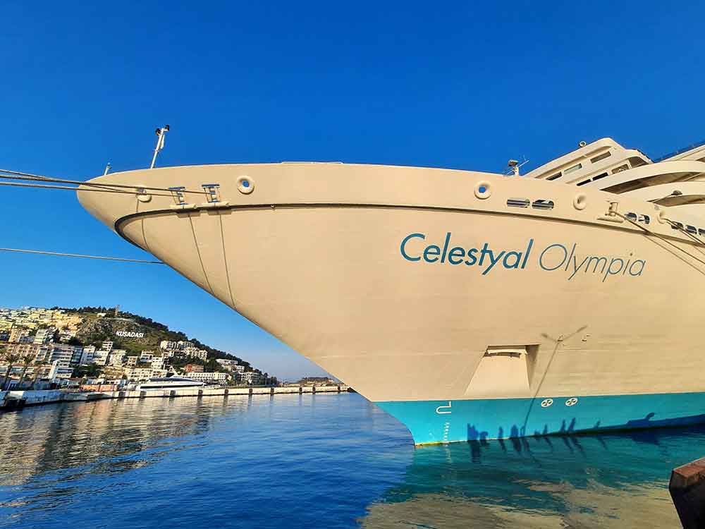 The cruise ship, Celestyal Olympia, is parked at the shore