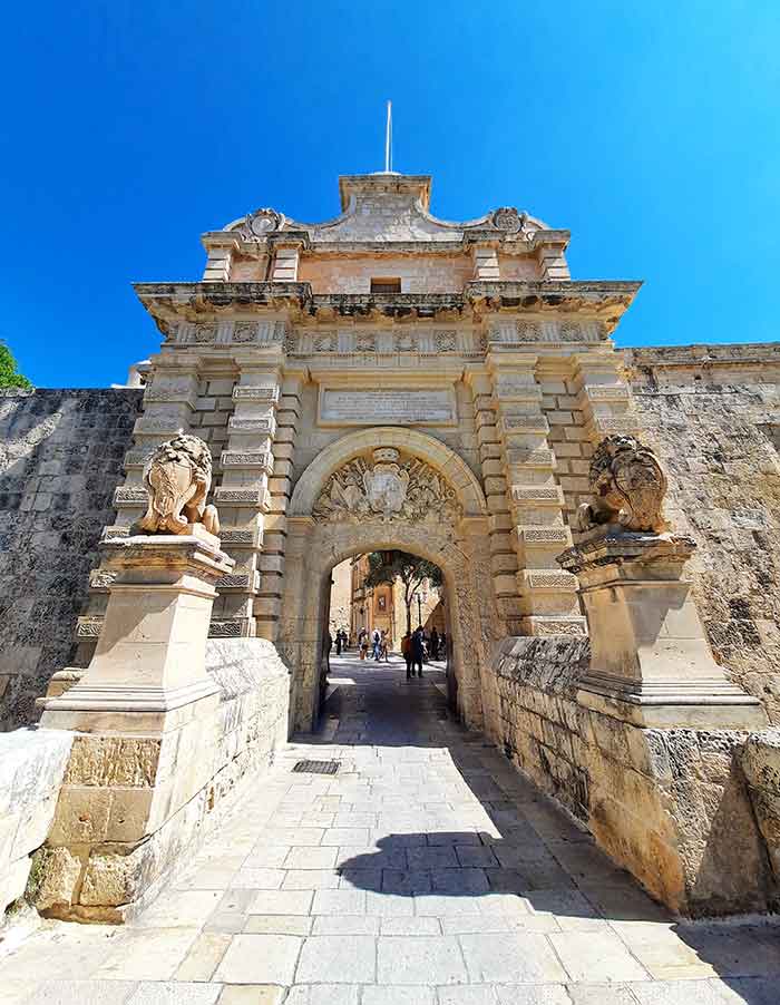 One Week in Malta: The Best 7 Days in Malta Itinerary 16 Gateway and Bridge into Mdina showcases the beautiful architecture at the entrance with inticate carves