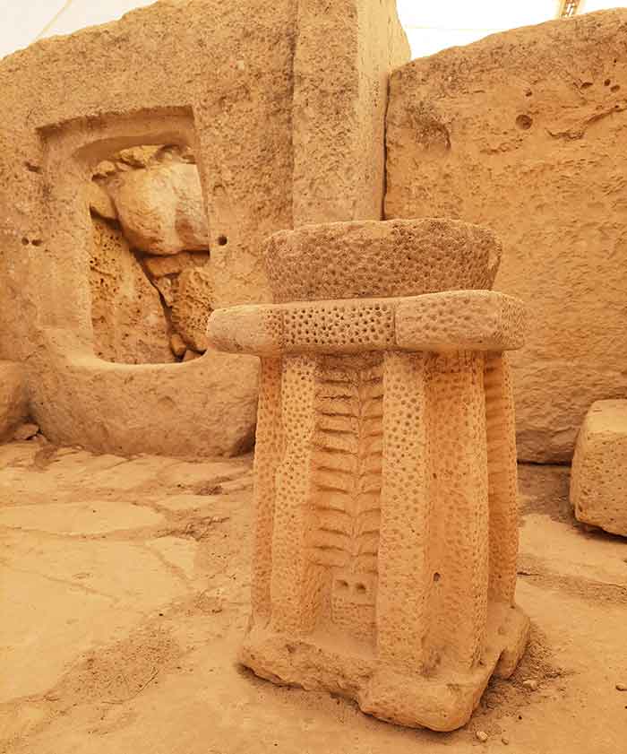 One Week in Malta: The Best 7 Days in Malta Itinerary 14 Hagar Qim and Manjdra Ruins features a large brown stone with a dotted carves