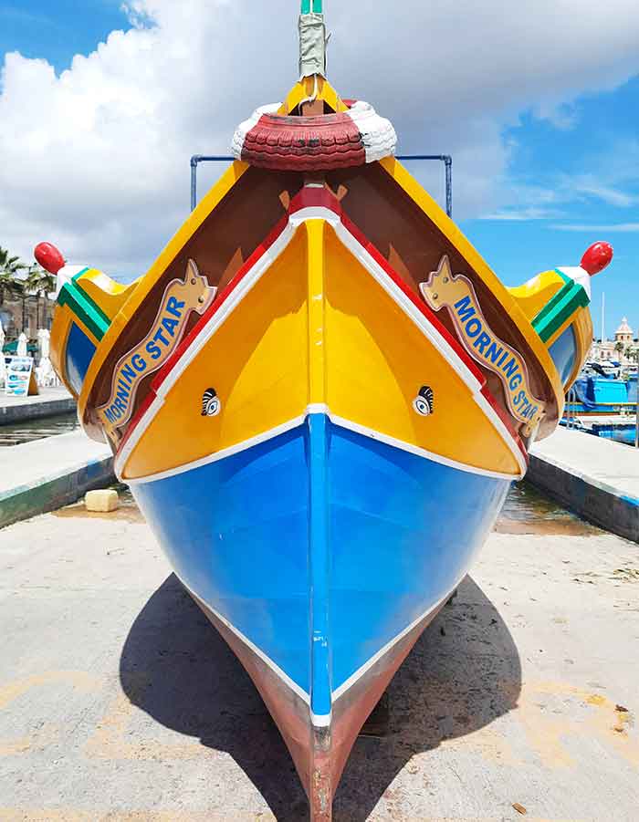 One Week in Malta: The Best 7 Days in Malta Itinerary 12 The Marsaxlokk Boat showcases vibrant yellow and blue colors, with the eyes of Osiris depicted on it