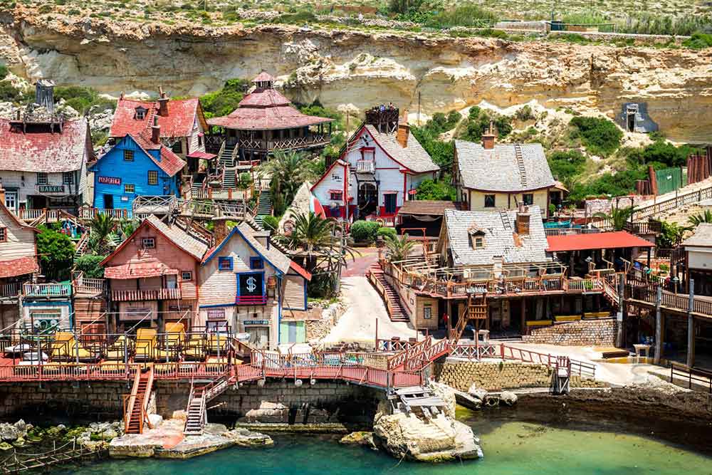 One Week in Malta: The Best 7 Days in Malta Itinerary 22 Popeye Village features colorful houses along the side of the mountain