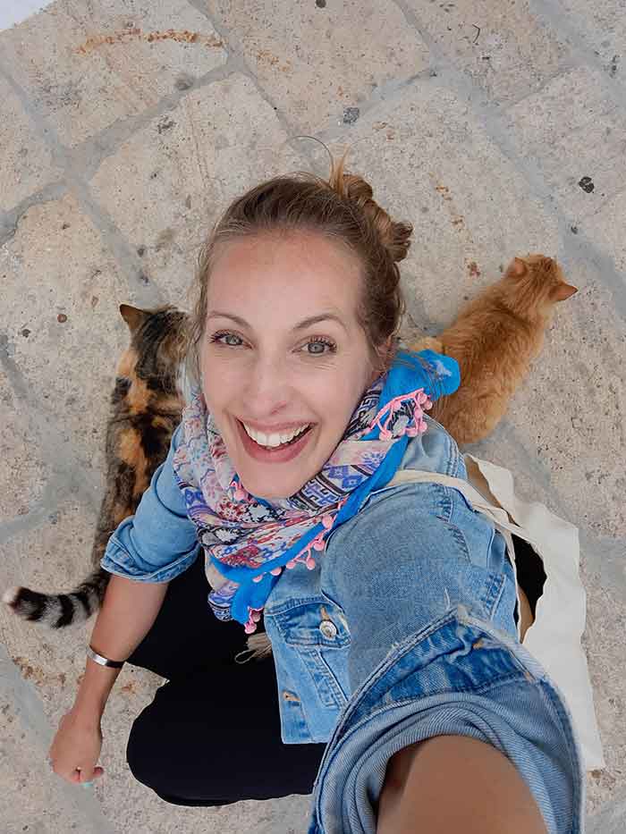 Taking a selfie with the friendly street cats of Chora