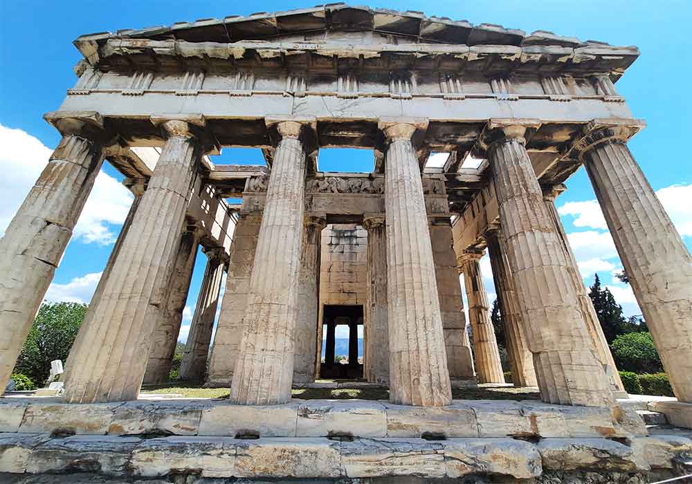 Ancient Agora with its marble columns, intricate carvings and weathered stone foundations standing in Athens Greece