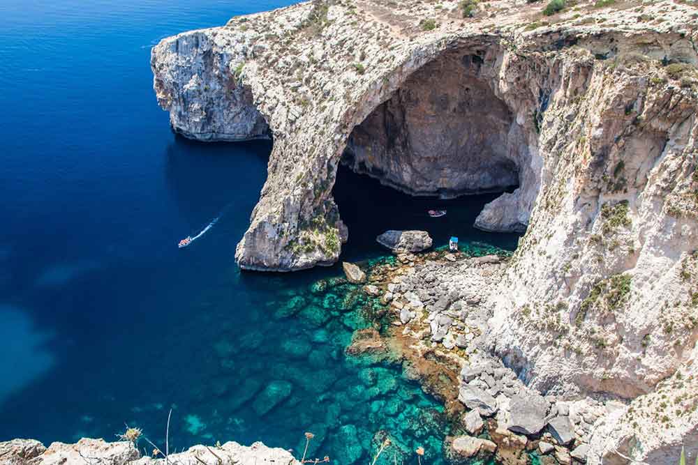 One Week in Malta: The Best 7 Days in Malta Itinerary 13 Stunning rock formation with a blue crystal waters at The Blue Grotto