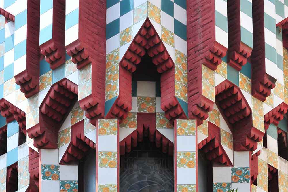 Barcelona Bucket List: 32 Best Things to Do in Barcelona, Spain 12 A red window detail from Casa Vicens with pattern of blue and flower ornaments