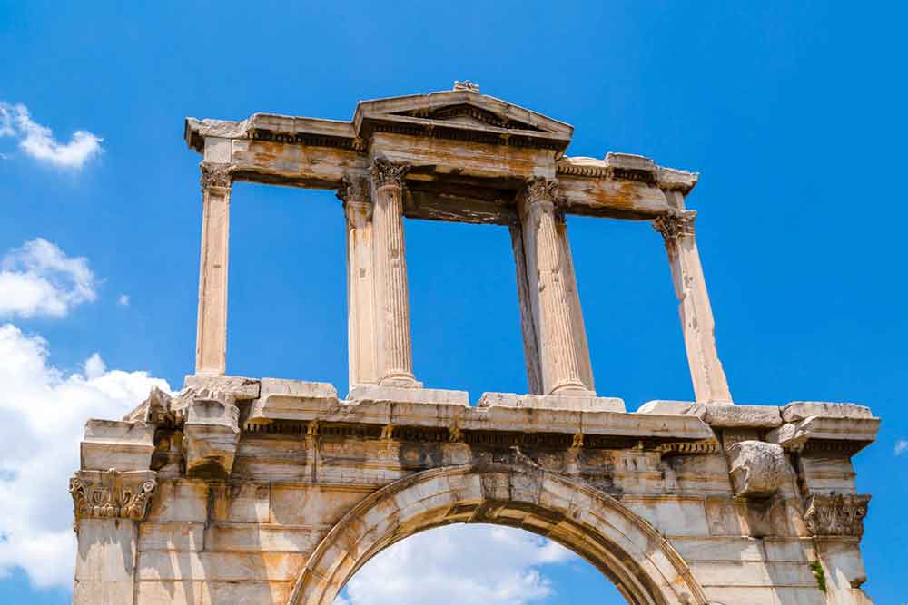 Hadrian's Arch showcases architectural details in a brown-white marble, adorned with columns