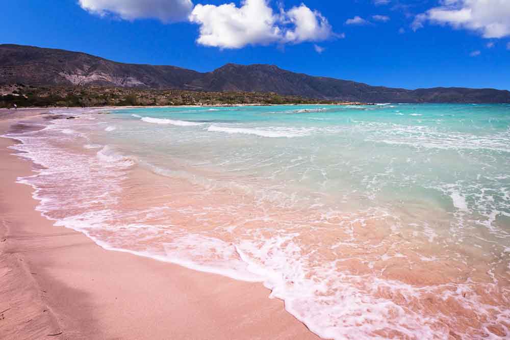 Pink Sand beach at Elafonisi with its turquoise water in a sunny day