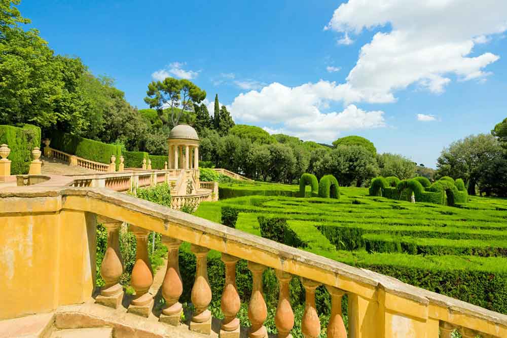 Barcelona Bucket List: 32 Best Things to Do in Barcelona, Spain 22 Parc del Laberint d'Horta features stunning gardens designed in a labyrinth pattern on a sunny day