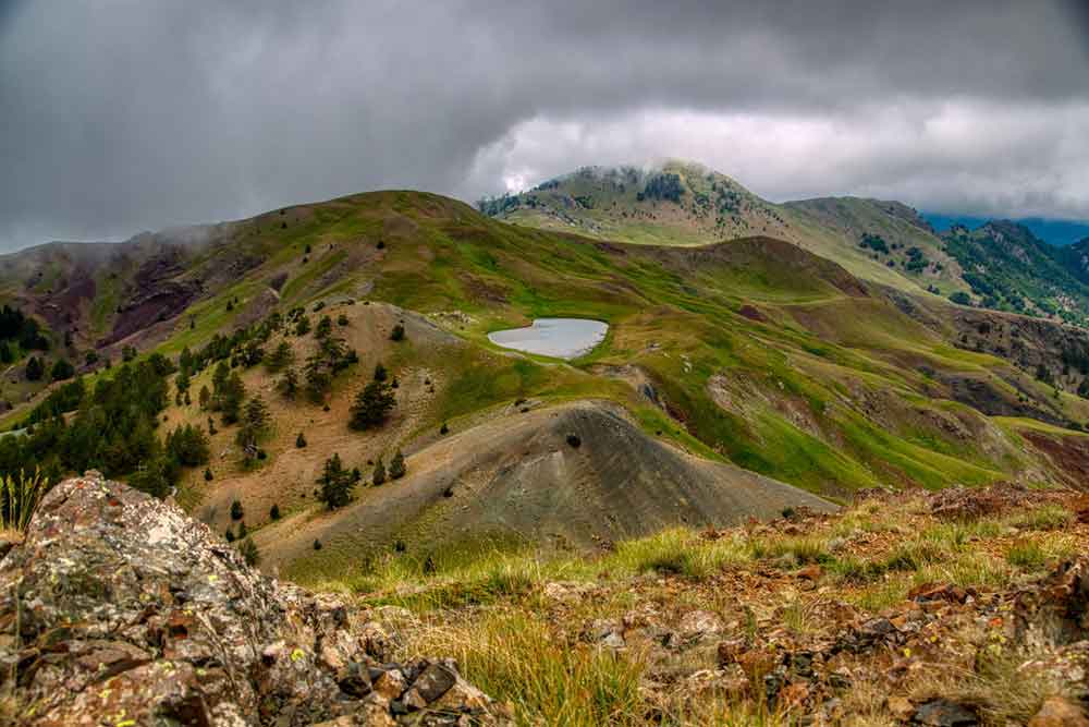 Dragon Lake in the middle of Epirus, Greece in a cloudy sky